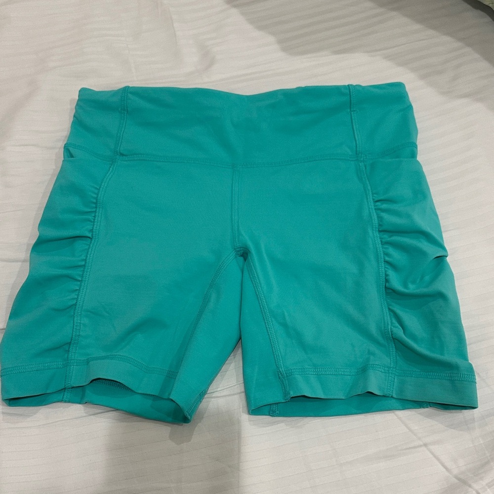 LIKE NEW LULULEMON TEAL SHORTS